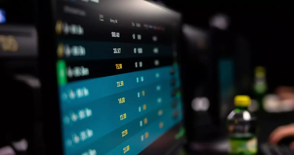 Esports betting odds displayed on a computer screen in a dark room