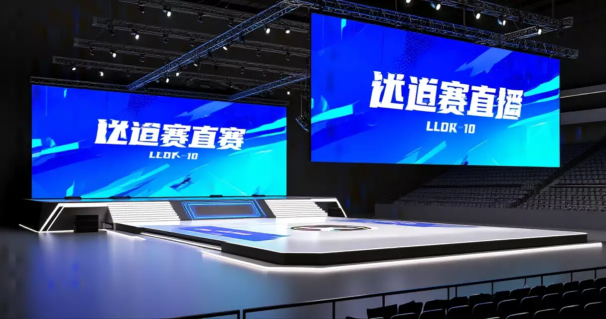LoL Esports arena stage with bold blue broadcast identity graphics on LED displays