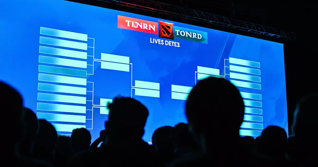Live Dota 2 PGL tournament broadcast on arena screen with audience