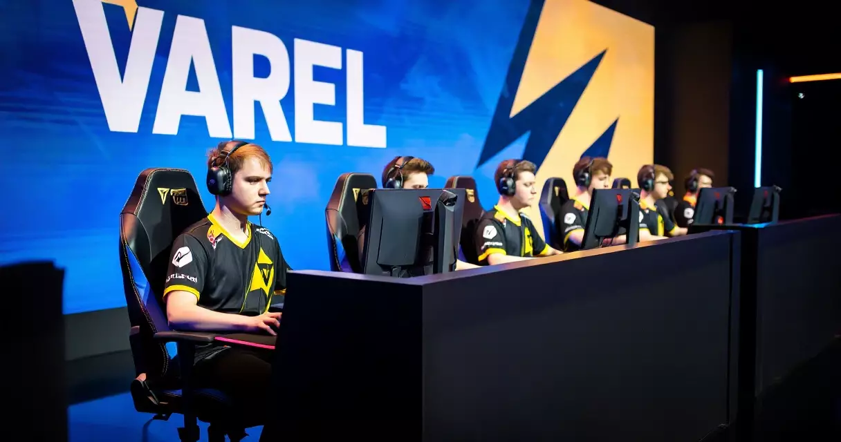 Professional esports players competing at branded tournament stage stations