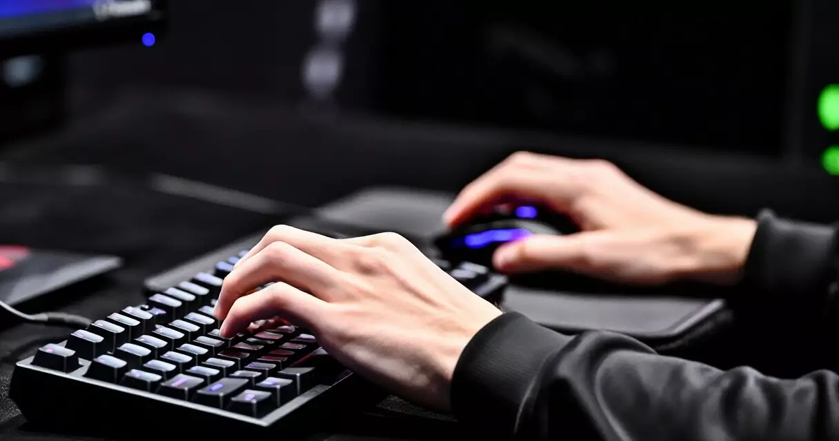 Esports player hands on gaming keyboard and mouse during a competitive match