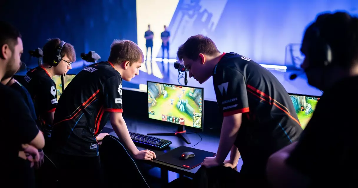 Esports players reviewing roster strategy before a tournament match