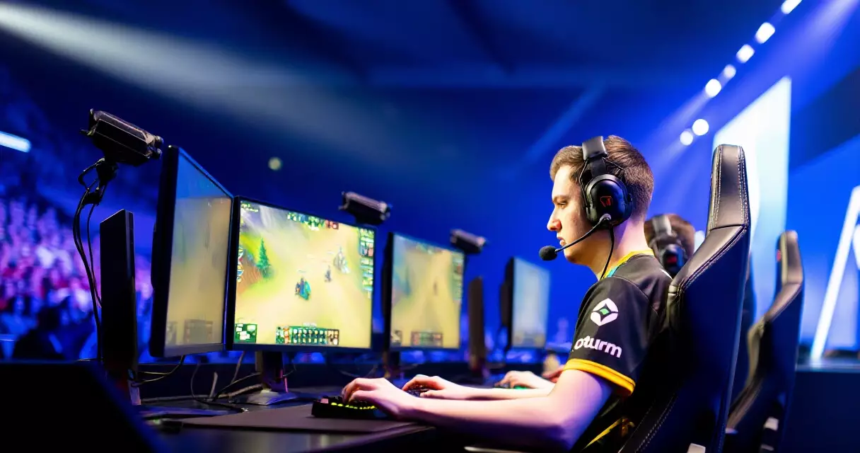 Pro esports player competing on stage at a major tournament in 2026