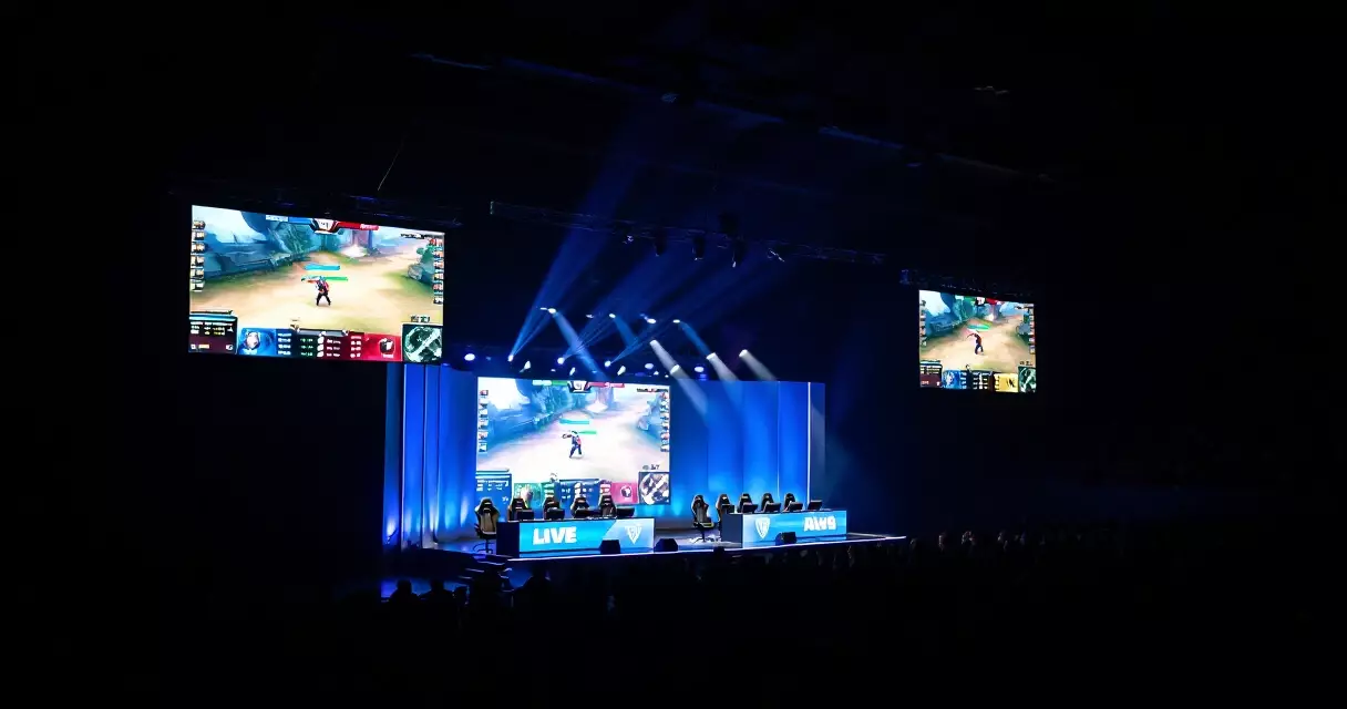 Esports arena during a live competitive match with screens and crowd