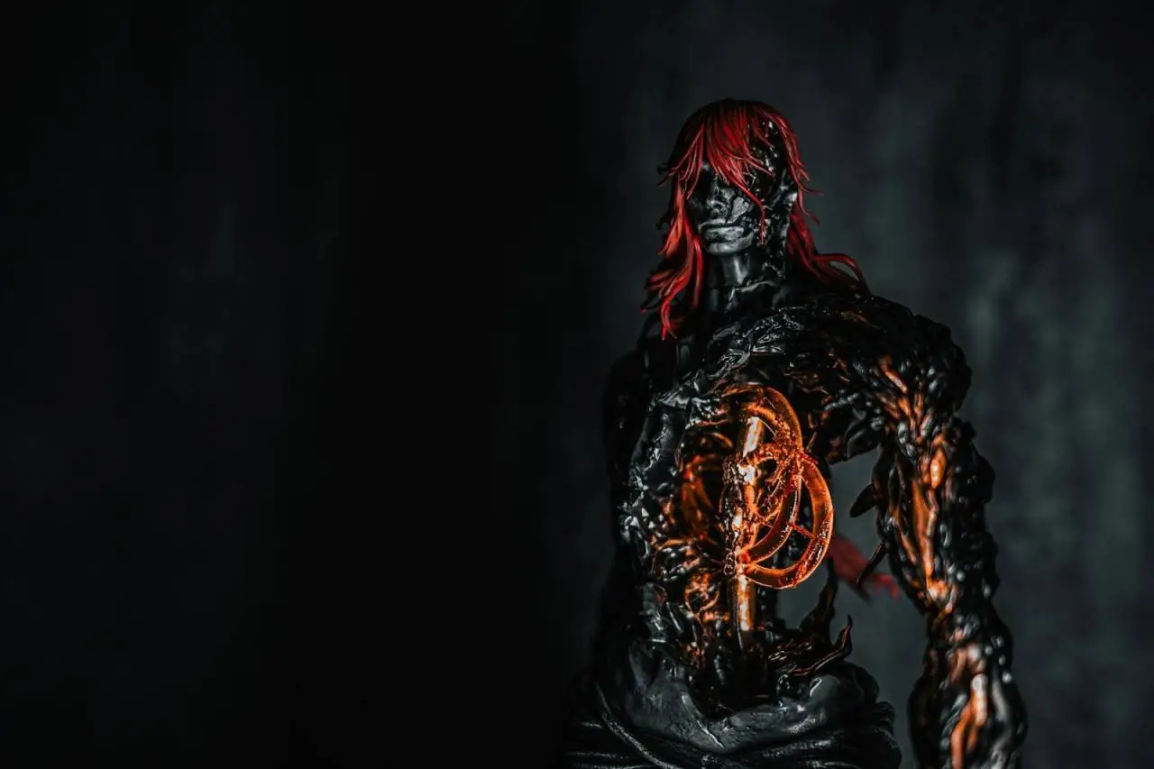 Dark figure with glowing orange core and red hair
